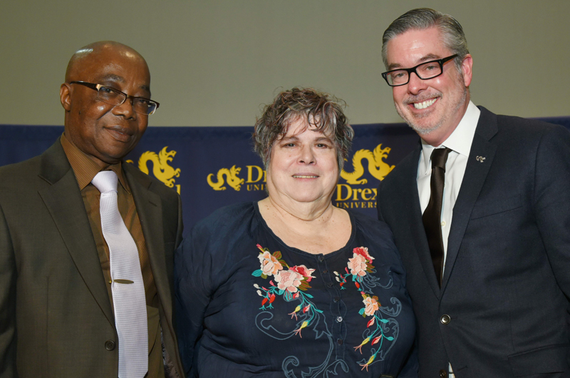 Miriam Kotzin, at center, with Drexel President John Fry, right, and Abisoeh Porter, PhD, left, head of the Department of English & Philosophy.